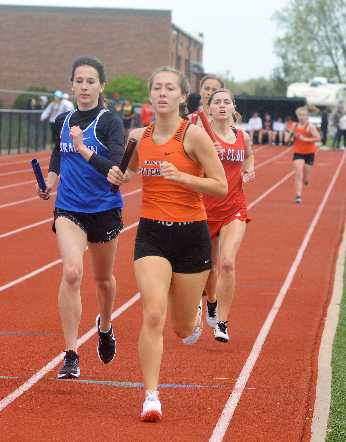 Kyah Weirich (center) is shown competing in the annual Four Rivers Conference (FRC) track meet this past spring hosted by Owensville High School at Dutchmen Field during the varsity girls 4x800-meter relay. Weirich’s senior season ended during the Missouri State High School Activities Association (MSHSAA) Class 3 Sectional 3 Track Meet at Hollister High School following a fifth-place finish in the same event.